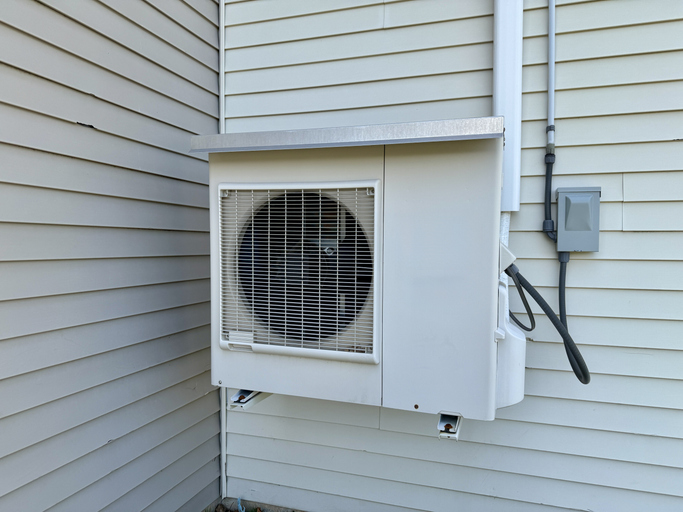 Close-up Of Building Exterior With Air Heat Pump